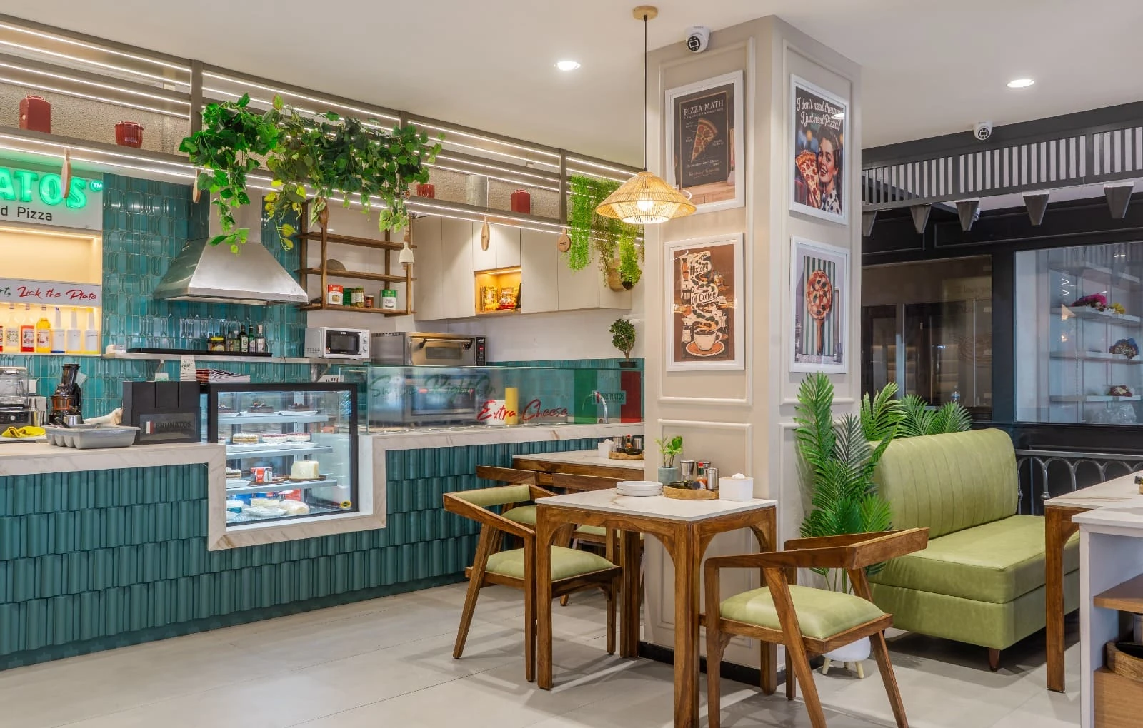 Brunatos interior with green seating, wooden tables and an open counter